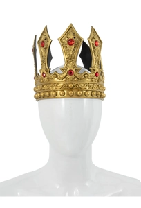 Detailed close-up of a royal gold crown with red gems and vintage carvings