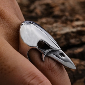 Punk style stainless steel bird skull ring featuring a bold gothic open design for unisex