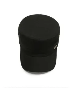 Top-down view of black cotton canvas cadet cap showing metal logo and fabric texture