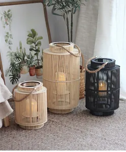 Detail of hand-woven rattan lanterns with hemp handles and warm LED candles