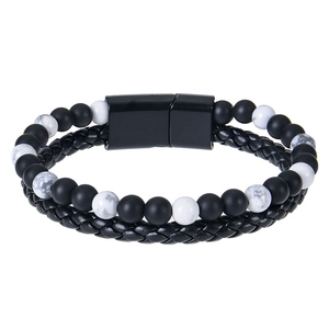 Detail of men's leather cord bracelet with tiger eye beads and black magnetic clasp