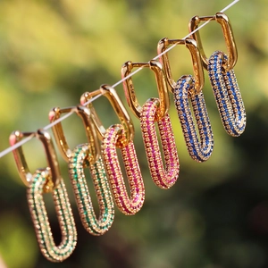 Detailed close-up of 18K gold plated rectangular earrings with multi-colored cubic zirconia