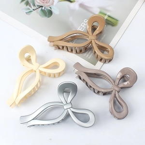 Minimalist large bow hair claws in matte colors including cream and mocha for thick hair