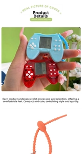 Close-up of retro mini tetris console keychain with LCD screen and functional buttons