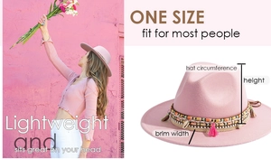 Pink wide brim fedora hat detail featuring colorful woven band with shells and tassels