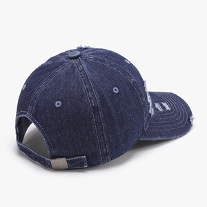 Distressed dark blue denim baseball cap with vintage frayed holes and adjustable metal buckle