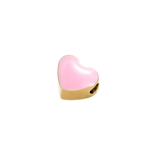 Detailed macro view of pink enamel heart pendant with golden metal finish for DIY jewelry
