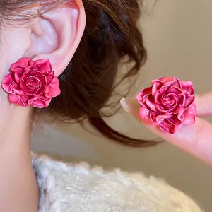Elegant rose petal stud earrings in deep magenta resin for a chic daily look
