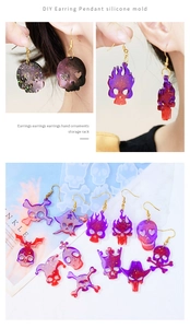 Macro shot of skull earrings made with silicone resin mold featuring colorful glitter effects