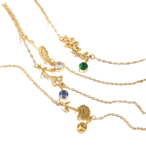Vintage gold necklace set with hollow floral pendants and colorful birthstone gems
