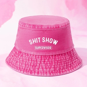 Pink washed cotton bucket hat featuring SHIT SHOW SUPERVISOR embroidery for summer sun protection