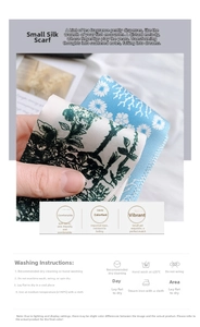 Detail of blue and white silk scarf with green floral print and washing instructions