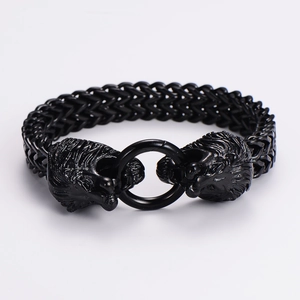 Detailed close-up of double lion head clasp on black stainless steel chain bracelet