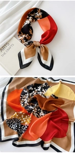Detail of color-block silk scarf with leaf patterns and irregular polka dots