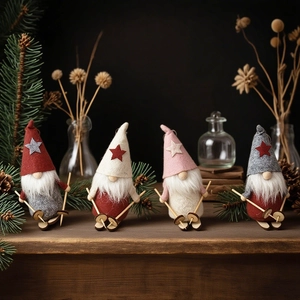 Set of four Nordic skiing Christmas gnomes in red, grey, white and pink wool felt