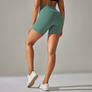 Rear view of bean green high waist yoga shorts featuring push-up seam and seamless design