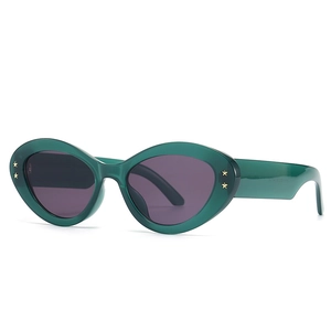 Modern baroque cat-eye sunglasses in transparent dark green with gold star details