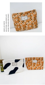 Detail view of corduroy makeup bags in floral orange and spotted white patterns