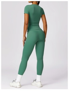 Rear side view of forest green quick-dry yoga t-shirt and high-waist leggings set
