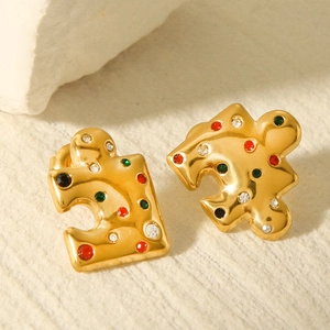 18k gold plated puzzle earrings with colorful zircon inlay on textured stone background