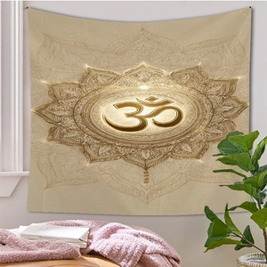 Detail of Om symbol and golden mandala pattern on a bohemian wall hanging tapestry