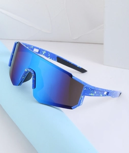 Detail of blue splattered cycling sunglasses with integrated mirror lens for sports