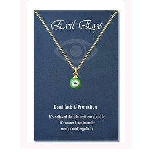 Golden stainless steel evil eye necklace displayed on a navy blue product greeting card