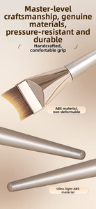 Close-up of crescent foundation brush with dense synthetic bristles and ABS handle
