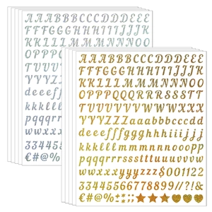 Close-up of glitter gold and silver alphabet stickers with sparkling sand texture