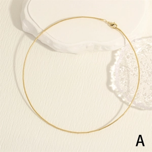 Minimalist 18K gold plated snake chain necklace with lobster clasp on stone display