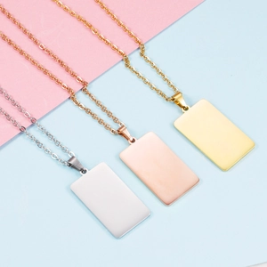 Minimalist geometric rectangle necklaces in silver, rose gold, and gold on pastel background