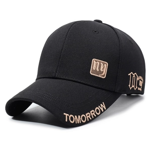 Black cotton baseball cap with gold NY embroidery and side lettering on a white background