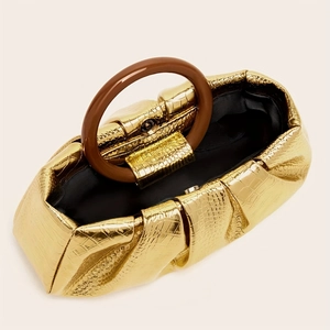 Detailed top view of gold crocodile embossed cloud bag with resin ring handle and interior