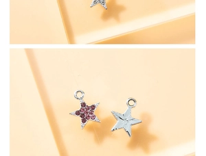 Macro detail of star pendant with pink rhinestones and silver metal texture for DIY jewelry