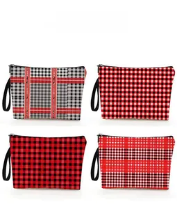 Macro view of four-piece plaid checkered makeup pouches with zippers and wristlet straps