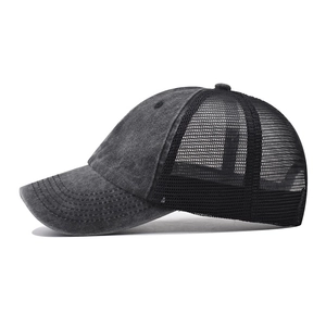 Deep grey washed cotton baseball cap with black mesh back and curved brim side view
