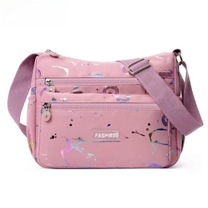 Detail of pink waterproof nylon sports waist bag with multiple zip pockets and fashion patch