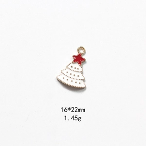 Macro shot of white enamel Christmas tree pendant, size 16x22mm and weight 1.45g