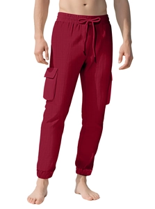 Detail of cargo pants with drawstring waist, large flap side pockets and elasticated cuffs
