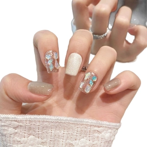Elegant cat-eye press-on nails in white and beige with iridescent opal stone accents