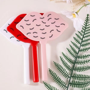 Lip-shaped makeup mirrors in pink, red, and white with handles for lash and facial use