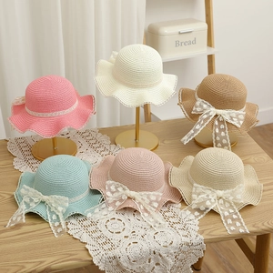 Kids woven straw hats in pastel colors with lace edges and heart print bows