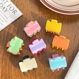 Colorful acrylic mini claw clips set in candy color block design on wood table
