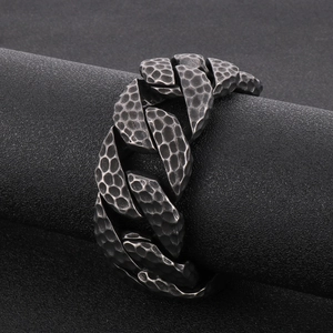 Close-up of vintage hammer-textured titanium steel heavy link chain with antique silver finish