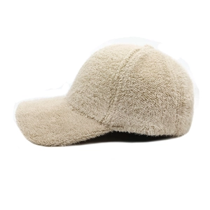 Detailed side view of beige teddy fleece baseball cap with soft plush texture for winter