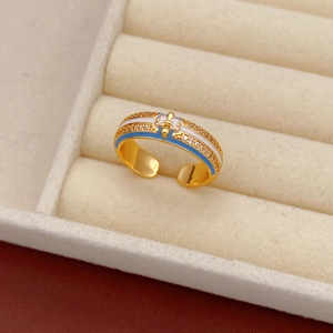 Macro shot of 18k gold plated ring featuring blue enamel and micro-pave cubic zirconia