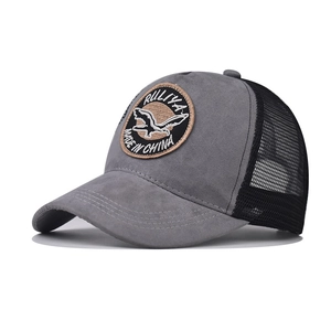 Grey faux suede baseball cap with black mesh and embroidered bird patch