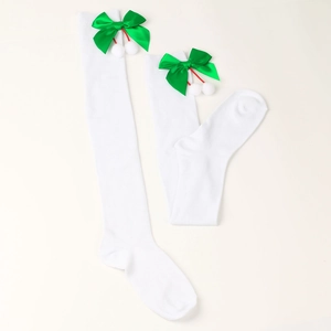 Detail of white over-knee socks with green satin bow and white plush balls for Christmas