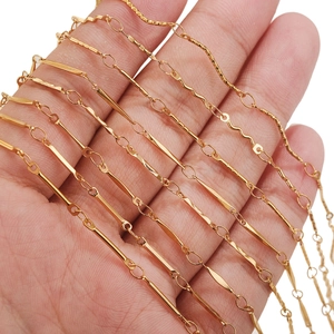 18K gold plated stainless steel S-link chain necklace held in hand for size comparison