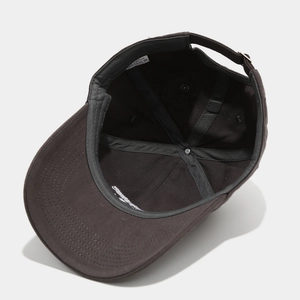 Detail view of cotton baseball cap interior featuring adjustable metal buckle and stitching